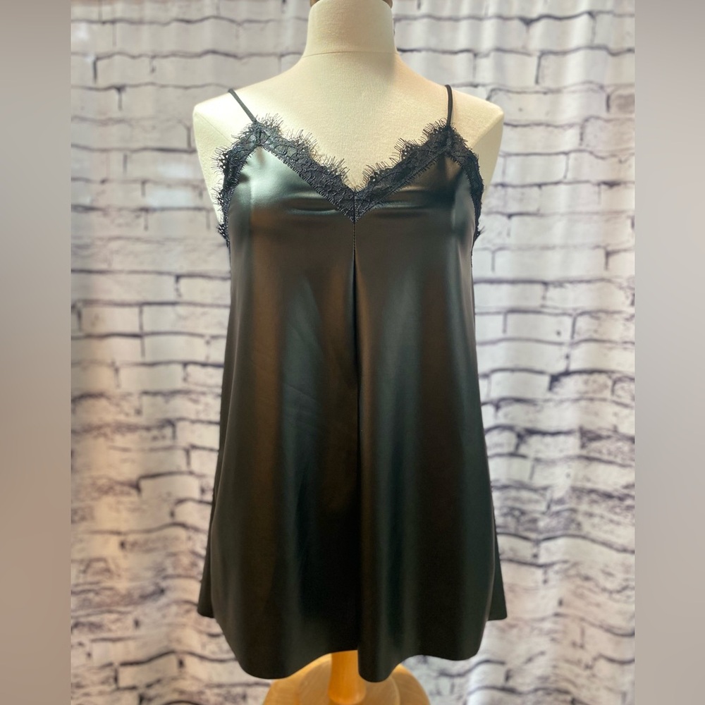 Black vegan leather camisole with lace trim.